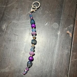 Key charm with key ring.